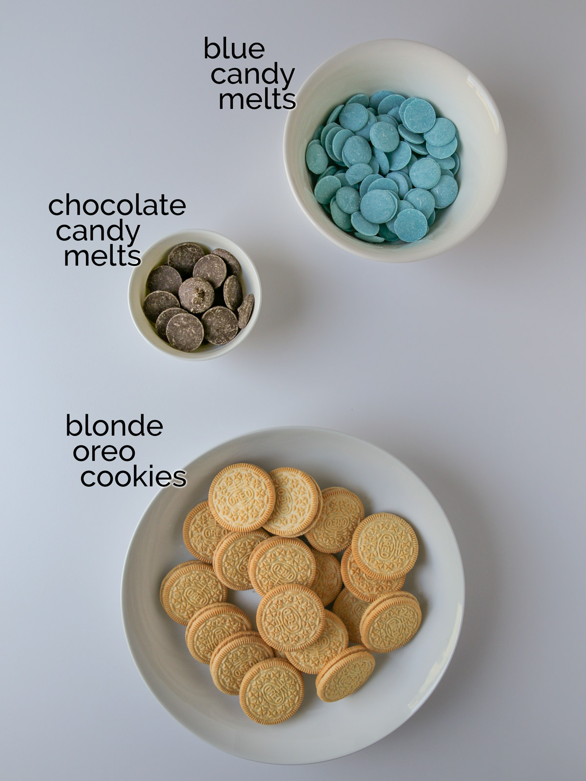ingredients for Easter Oreos laid out on white table.