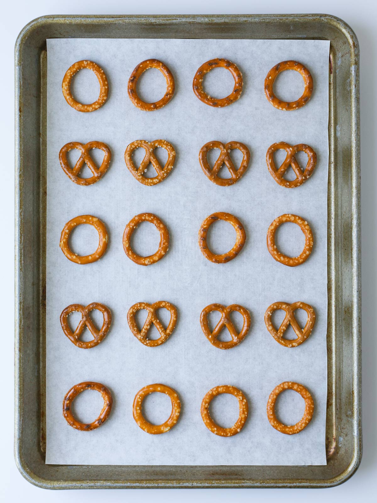 pretzels laid out on a lined baking sheet.