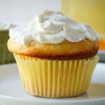 lemon cupcake topped with sweet cream cheese.
