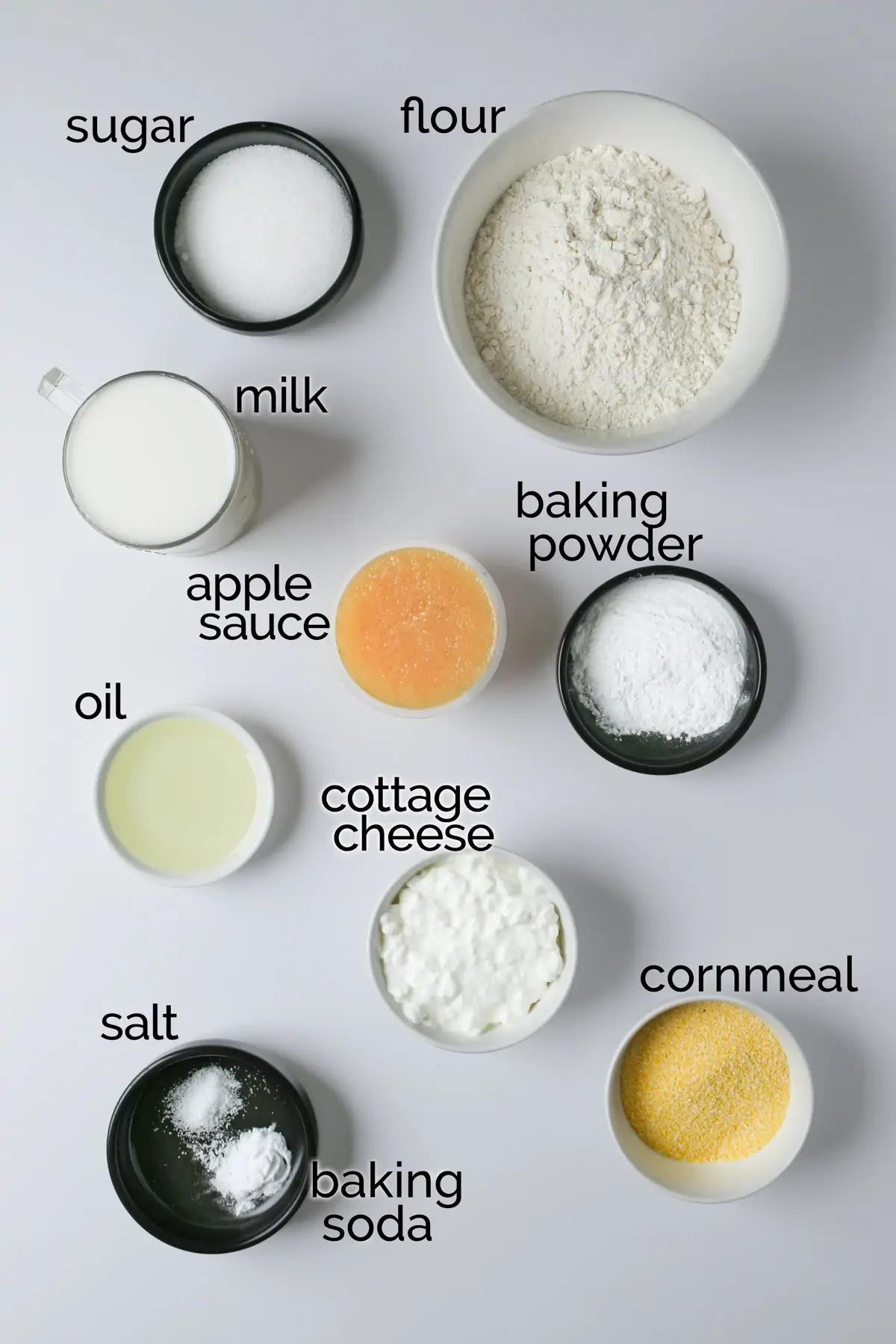 ingredients for eggless pancakes on white table.