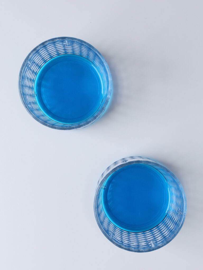 blue curaçao syrup on glasses. 