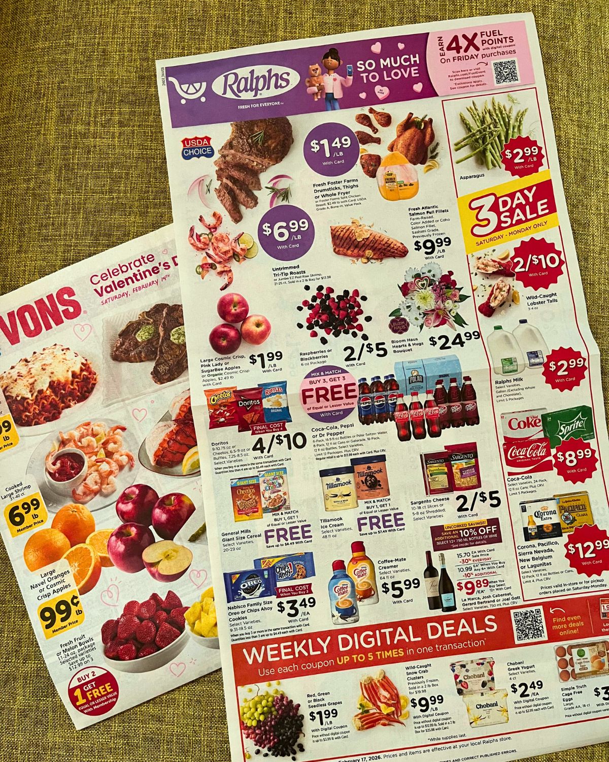 grocery sales flyers on green cloth.