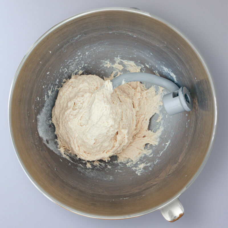 dough ball mixed in mixer bowl.