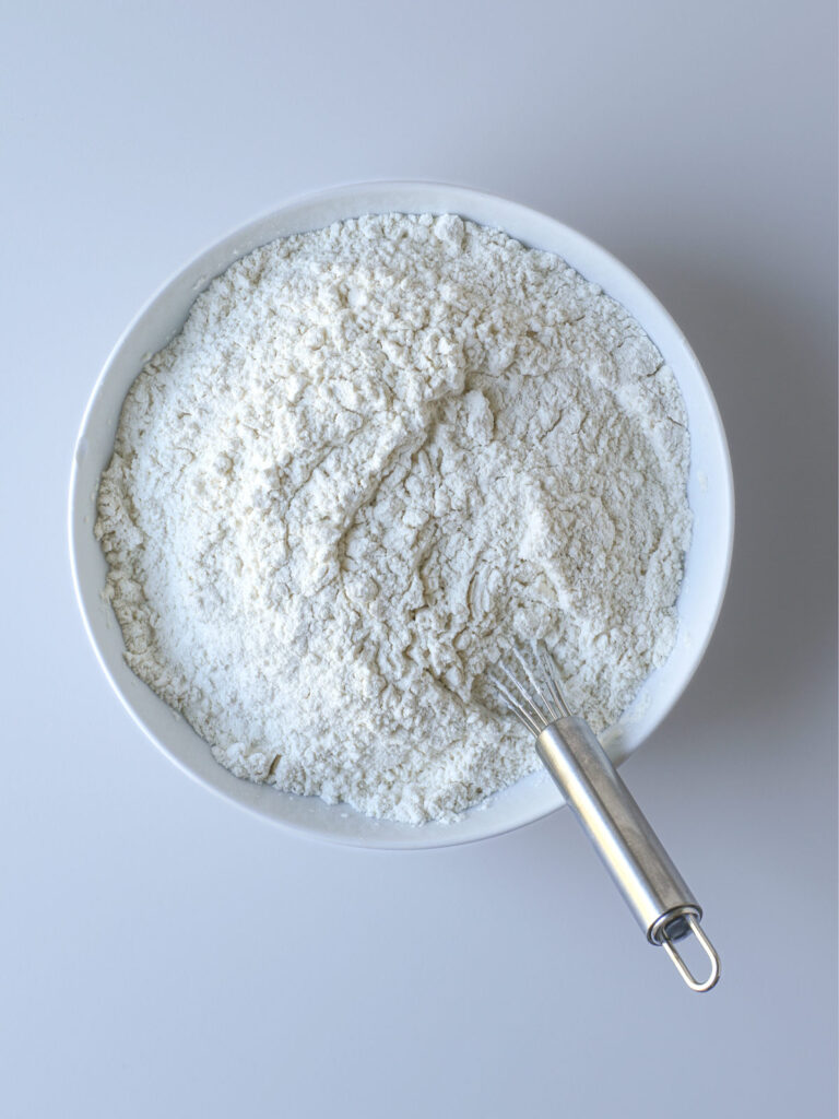 dry ingredients whisked together into a white bowl.