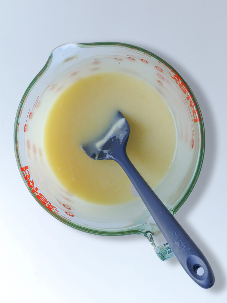 the blended wet ingredients in the Pyrex bowl.
