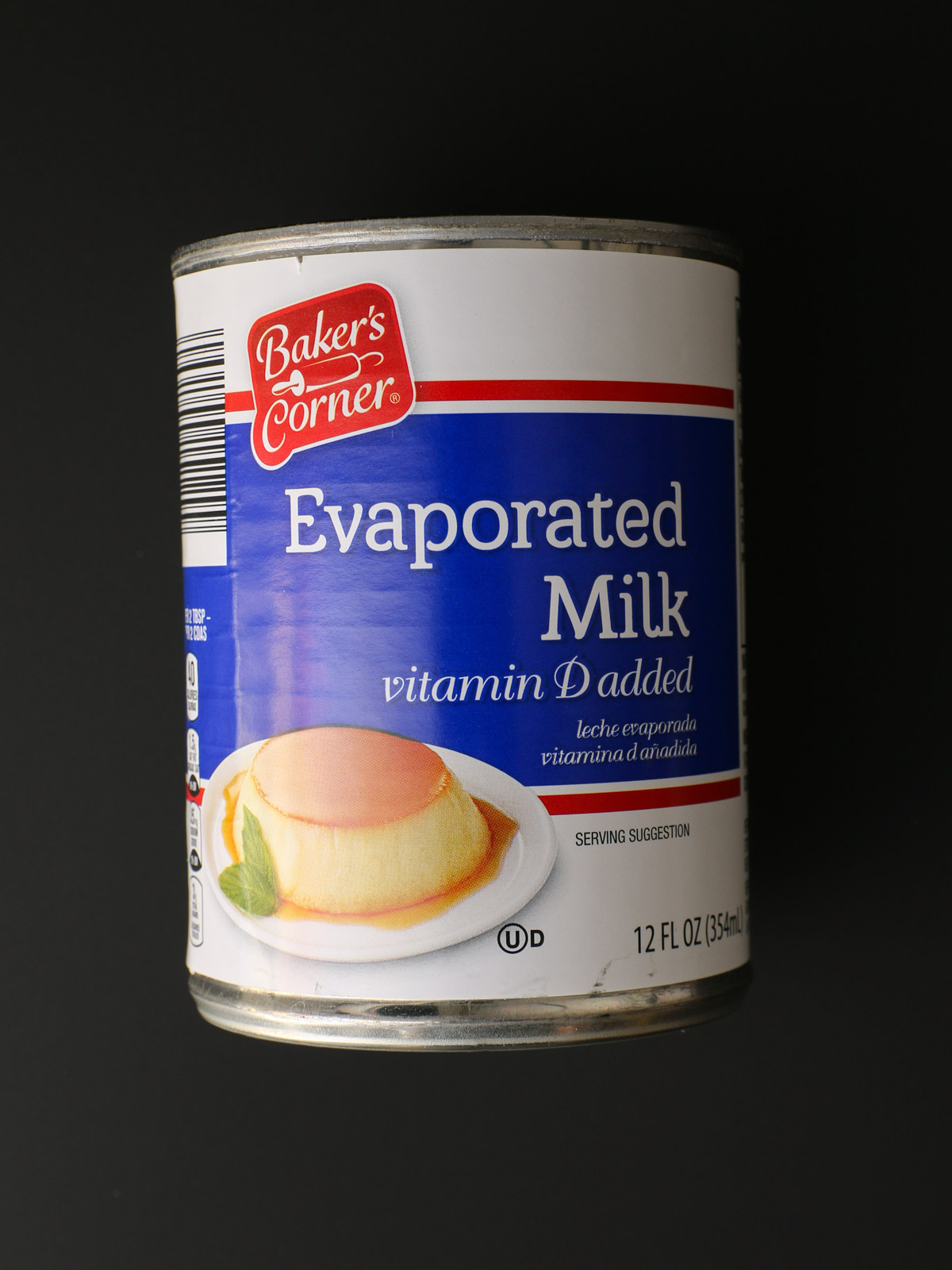 a can of evaporated milk with a black background.