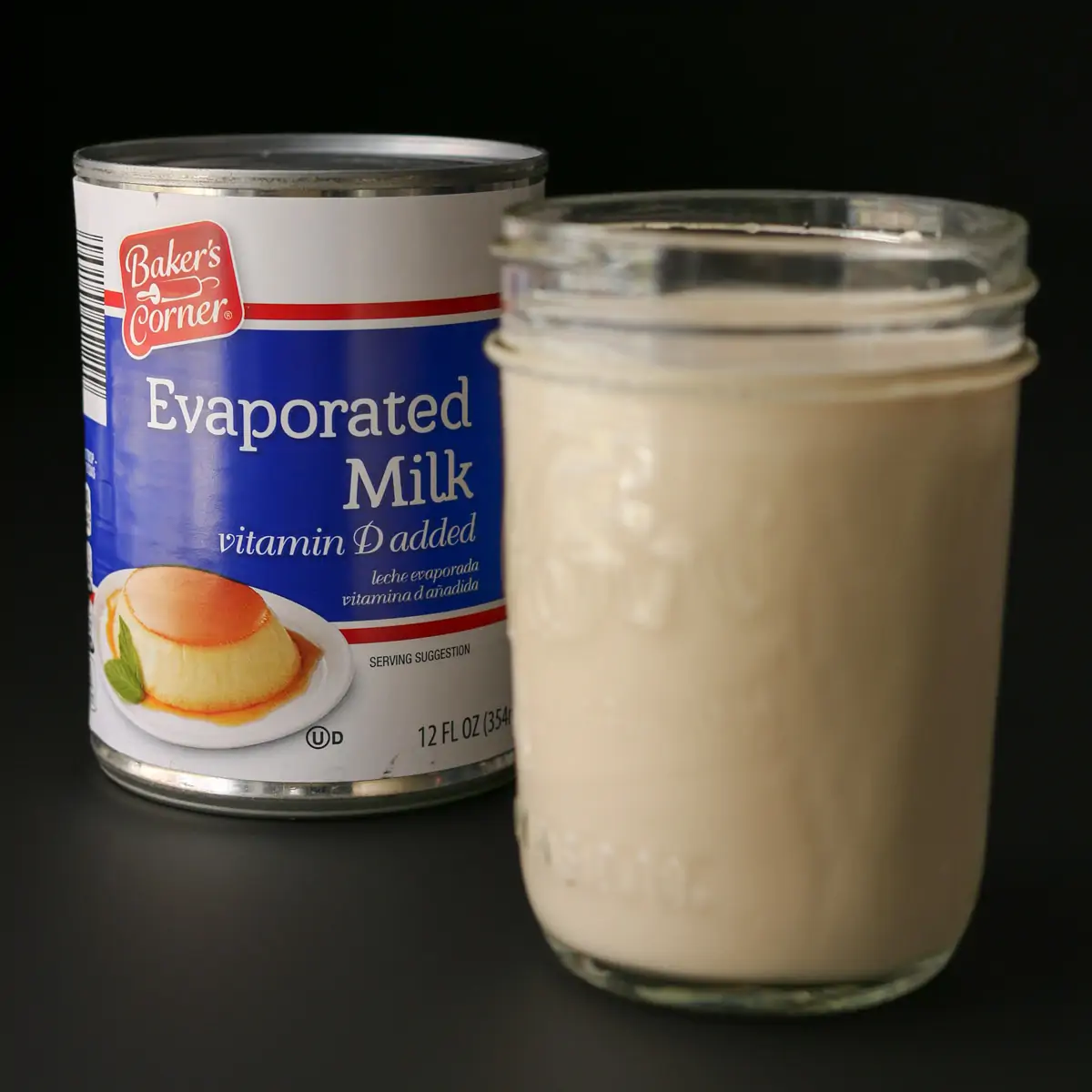 jar of evaporated milk next to can of ALDI evaporated milk on a black background.