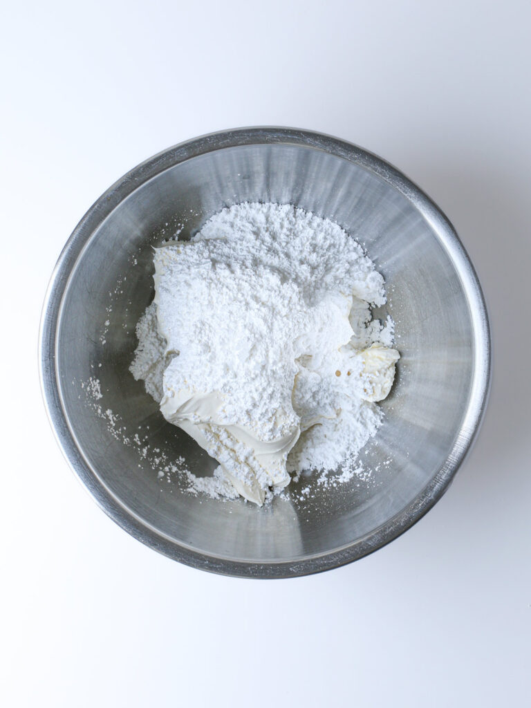 cream cheese and powdered milk in bowl.