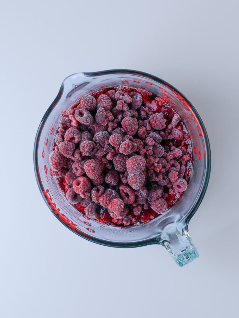 frozen berries added to the hot jello mixture.
