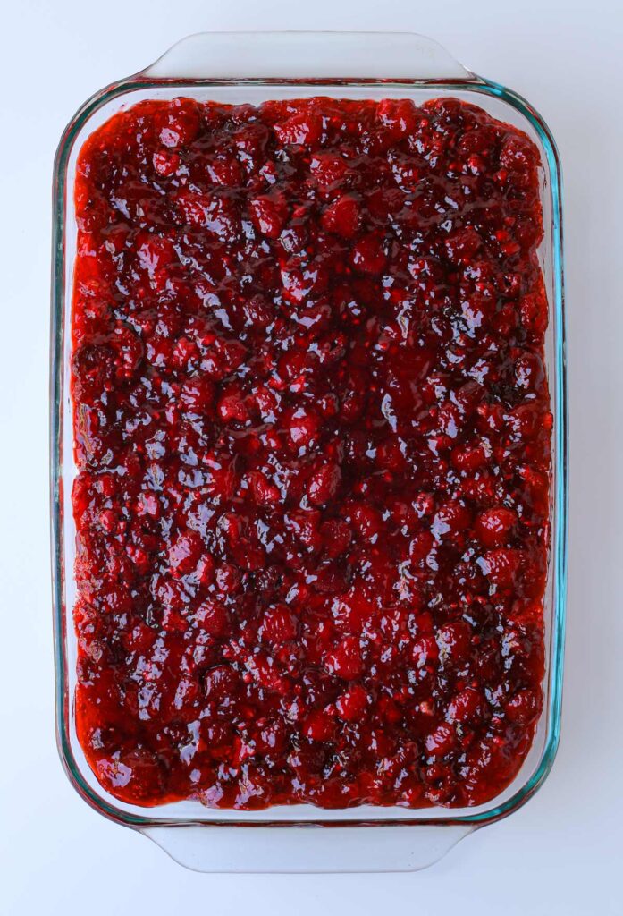 jello and berries spread over the cream cheese filling.