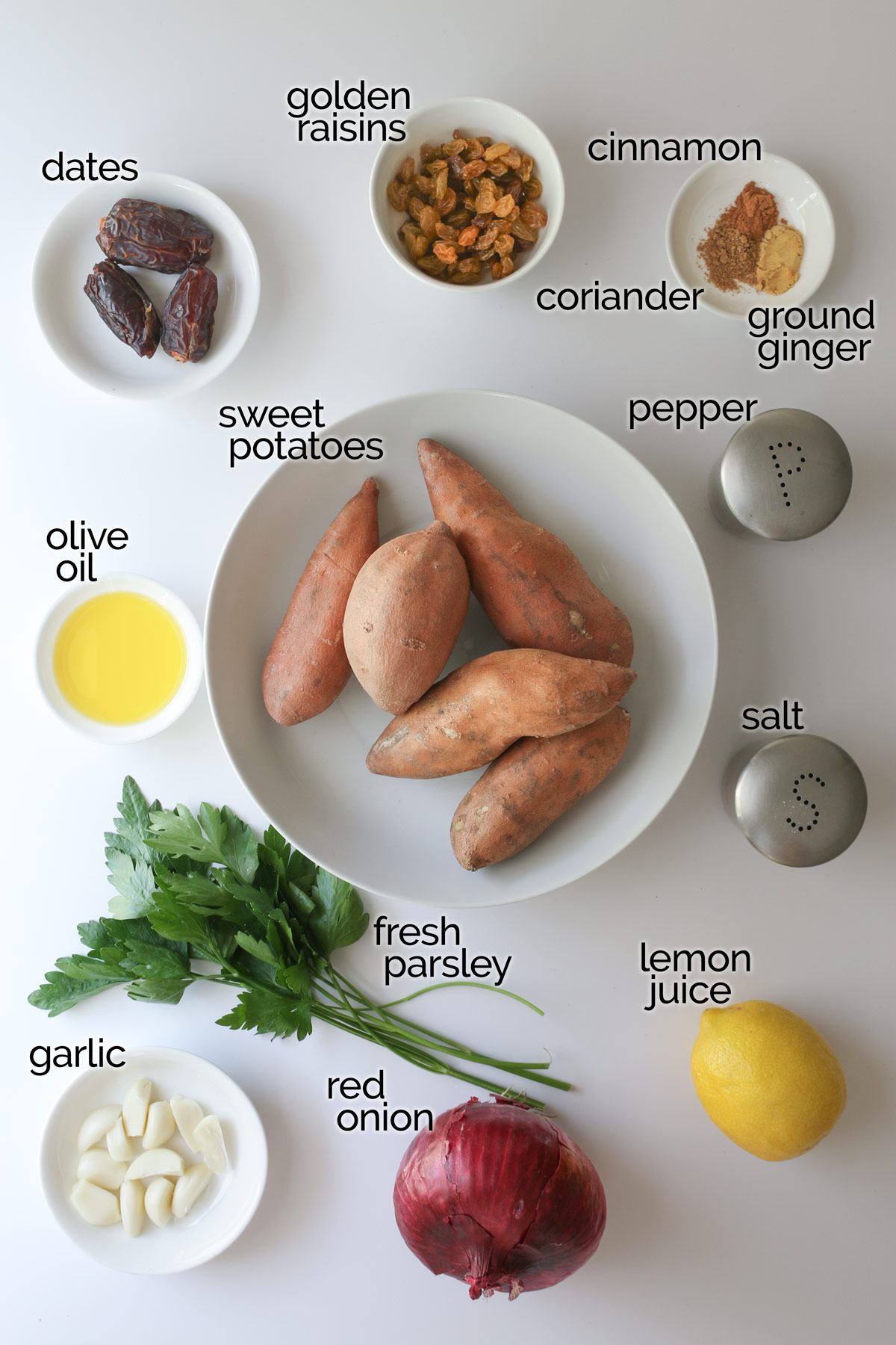ingredients for sweet potato salad laid out on a white counter.