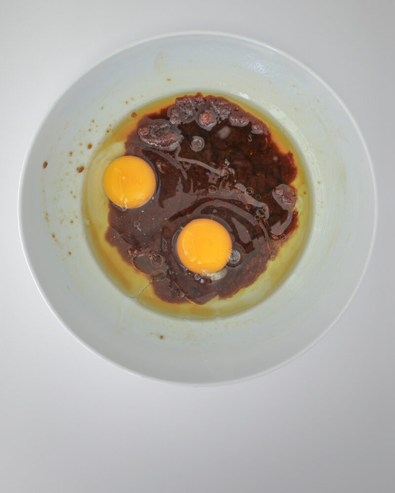 adding egg to molasses mixture.