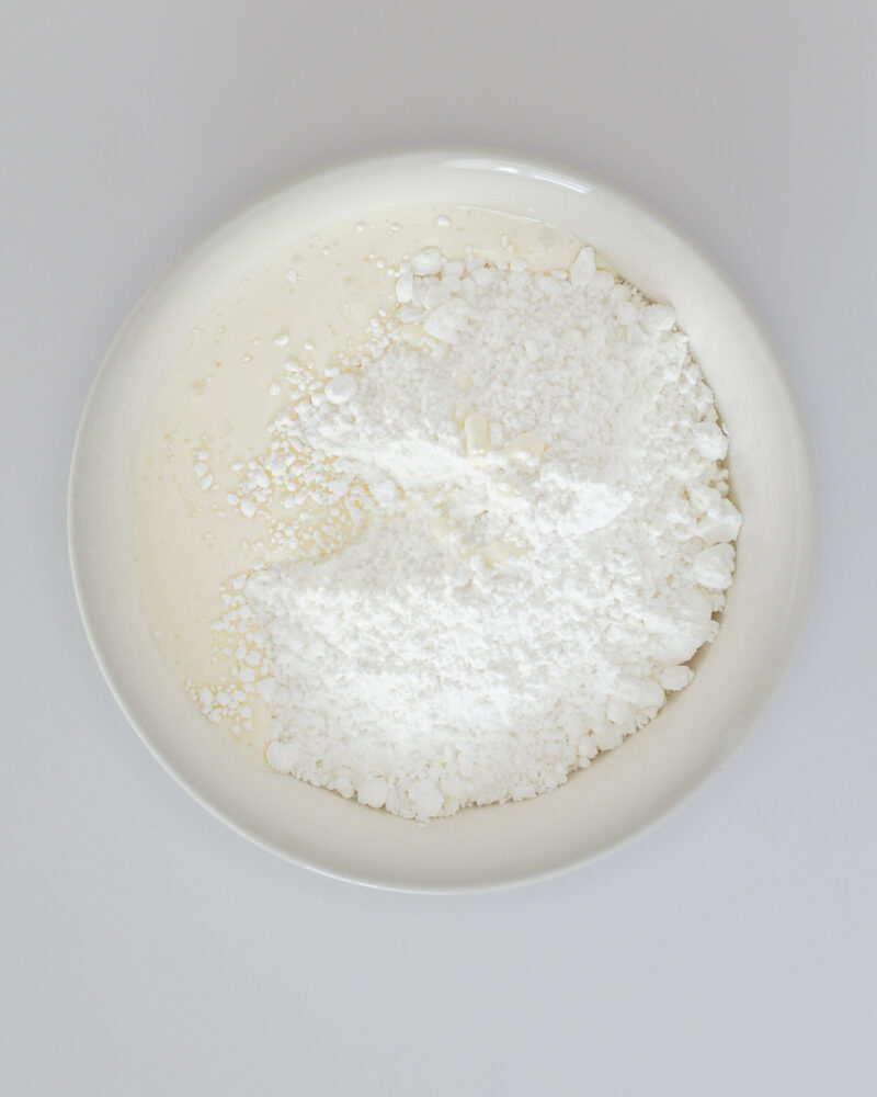cream and powdered sugar in a small white bowl.