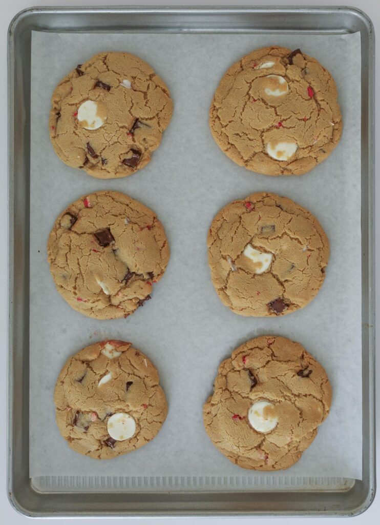 baked cookies on parchment-lined tray.