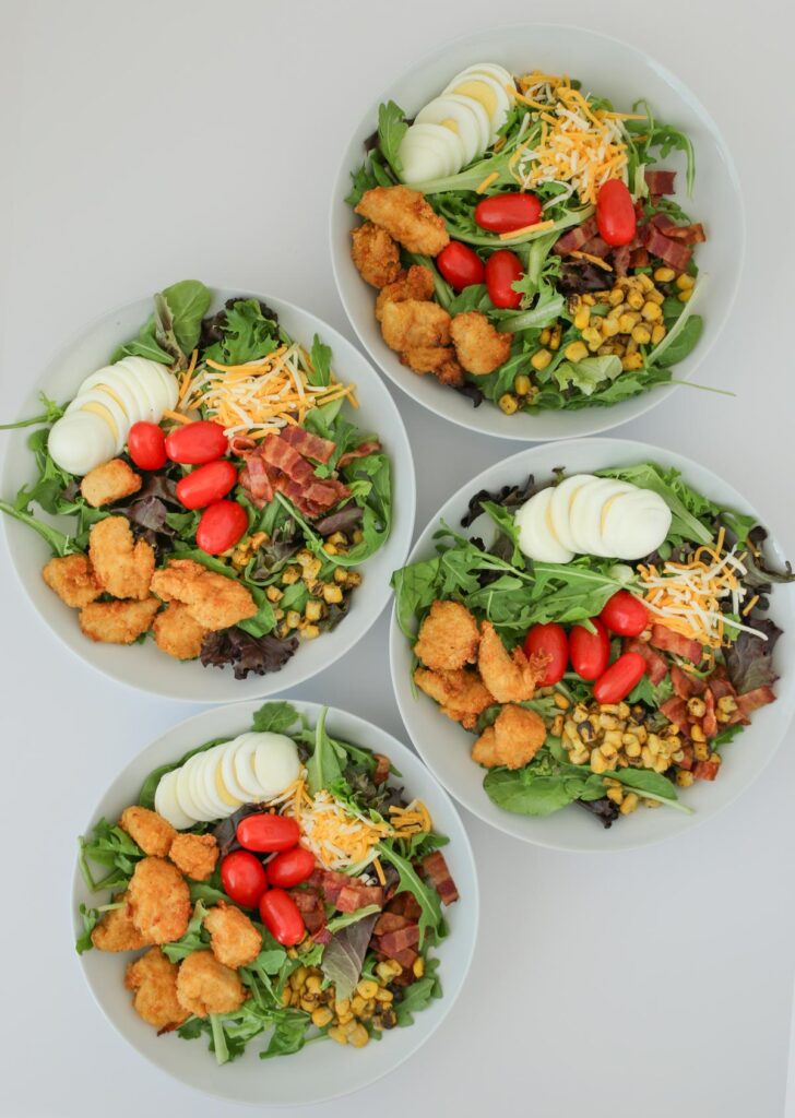chicken nuggets added to the four salads.