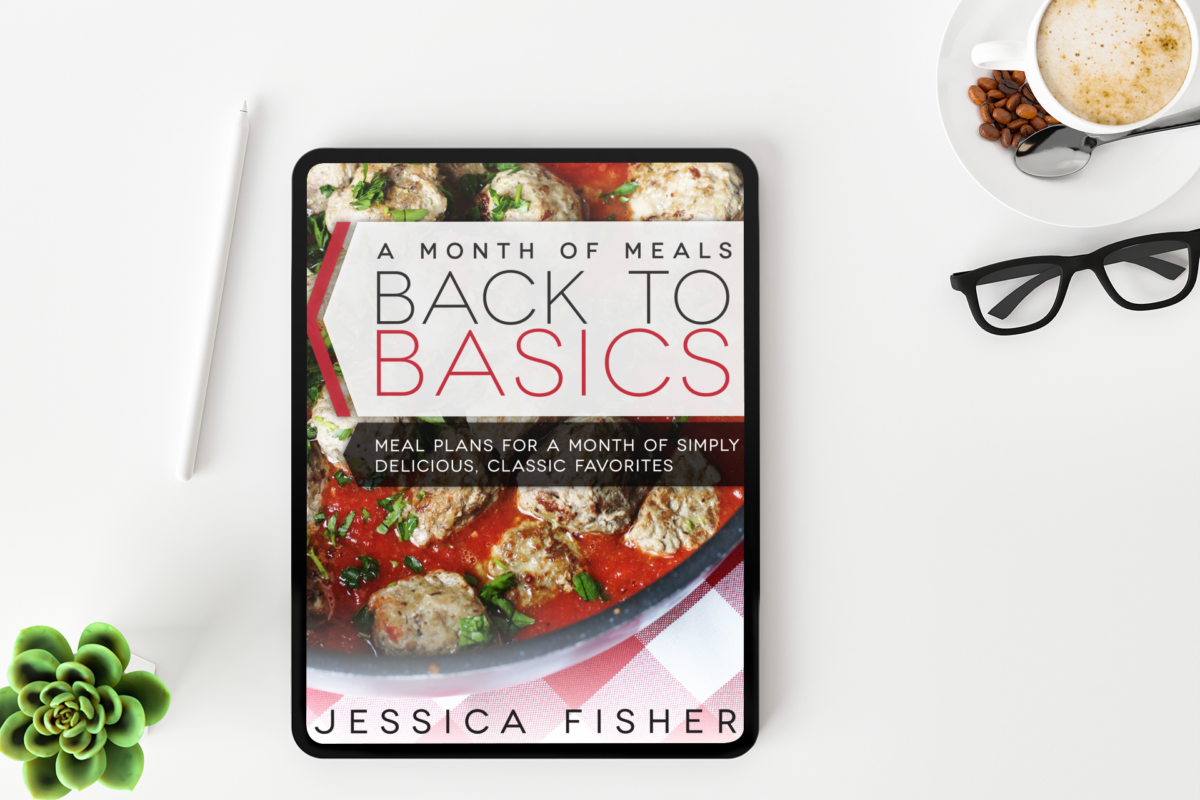 flatlay of ipad with cover image of back to basics meal plan along with apple pencil, glasses, and espresso.