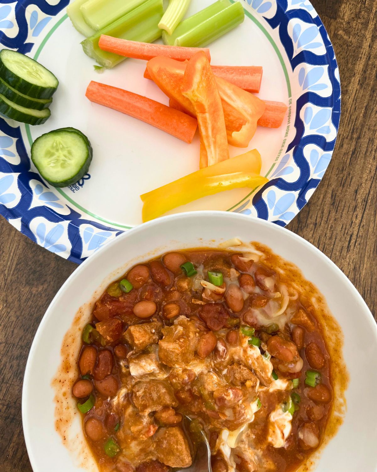 bowl of chili and plate of veggies.