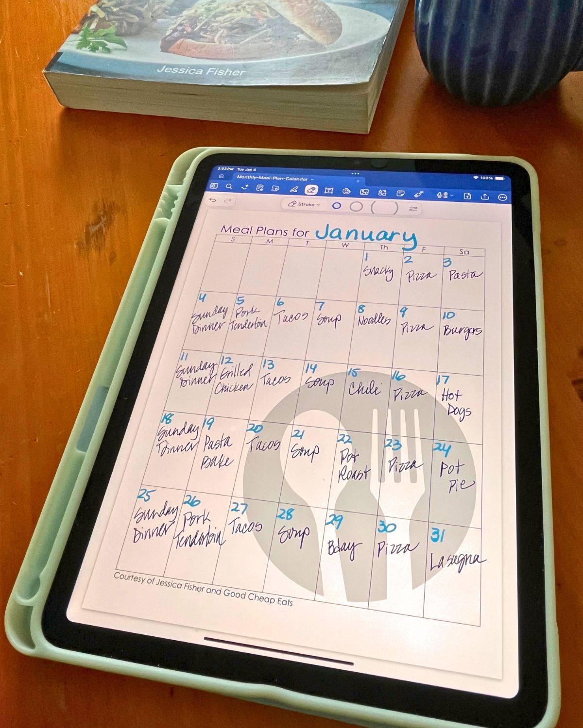 monthly meal plan template on iPad with days filled in.