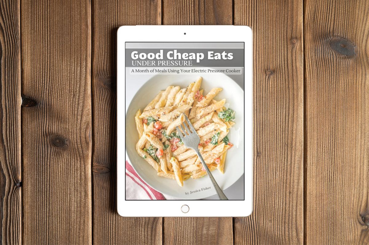 Good Cheap Eats Under Pressure cover image on an ipad on a wooden table.