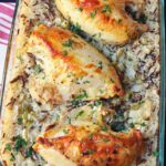 chicken baked on a bed of rice and wild rice.