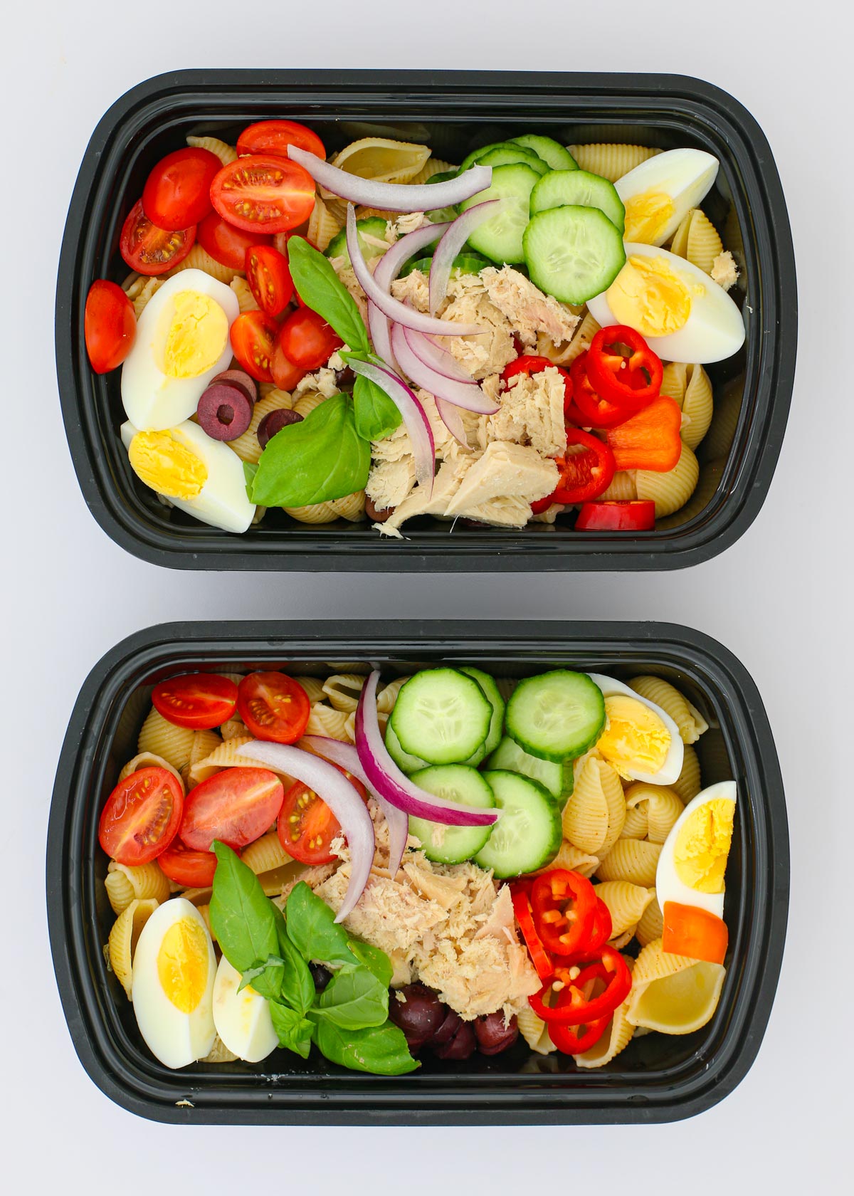 meal prep boxes filled with tuna pasta salad.