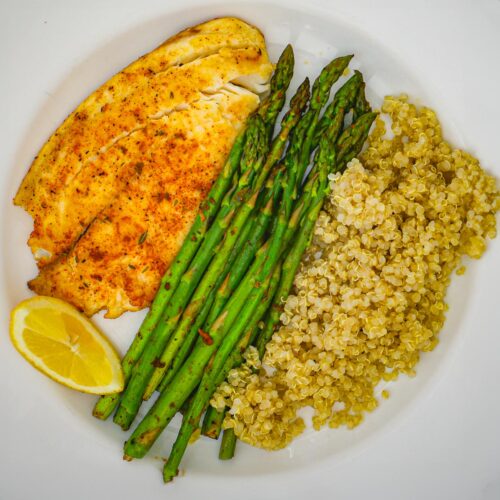 overhead shot of dinner plate with fish, asparagus, and quinoa pilaf.