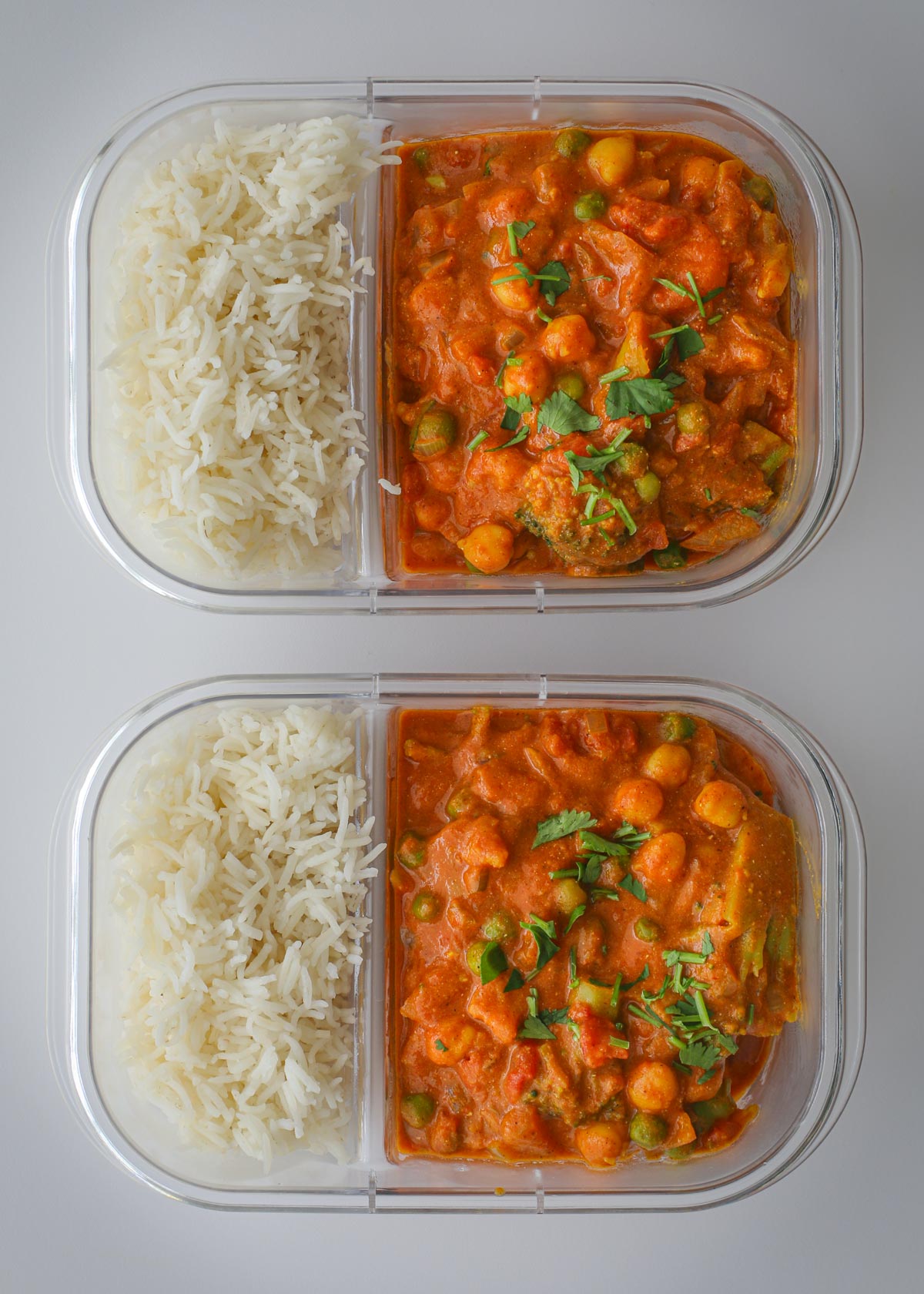meal prep dishes full of veggie curry.