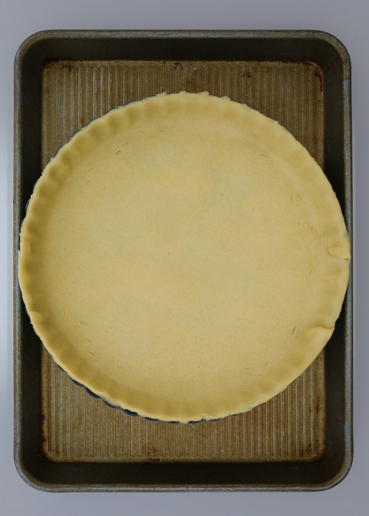 pie crust in quiche pan.