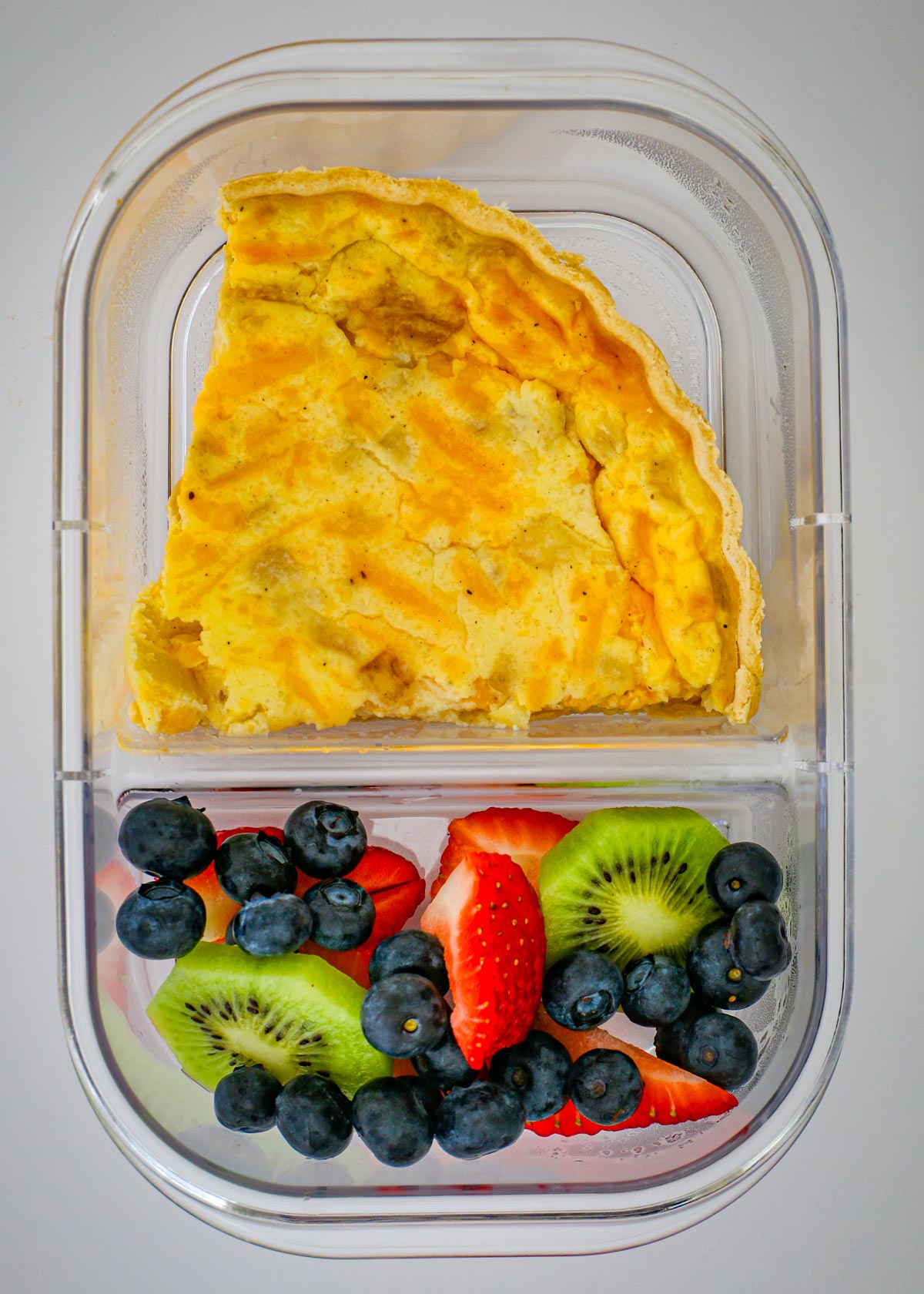 meal prep quiche with fruit salad.