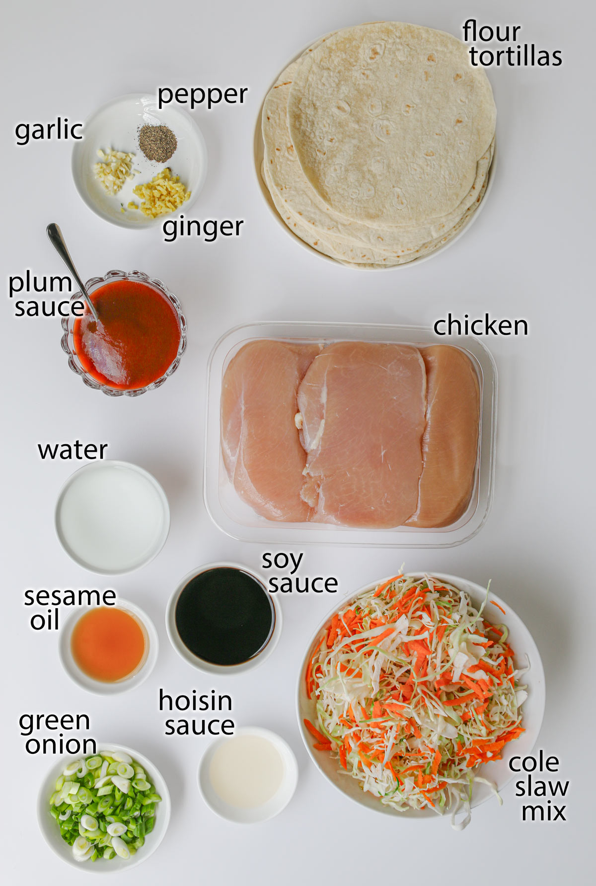 ingredients for moo shu chicken laid out on a white counter.