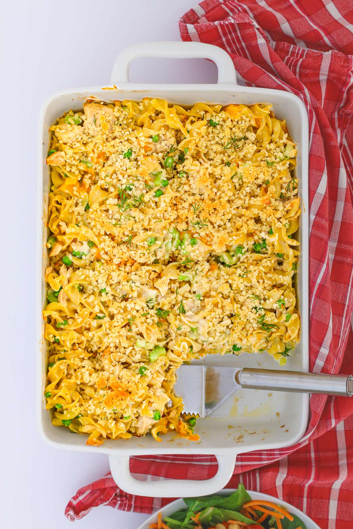 overhead shot of tuna noodle casserole with a piece removed.