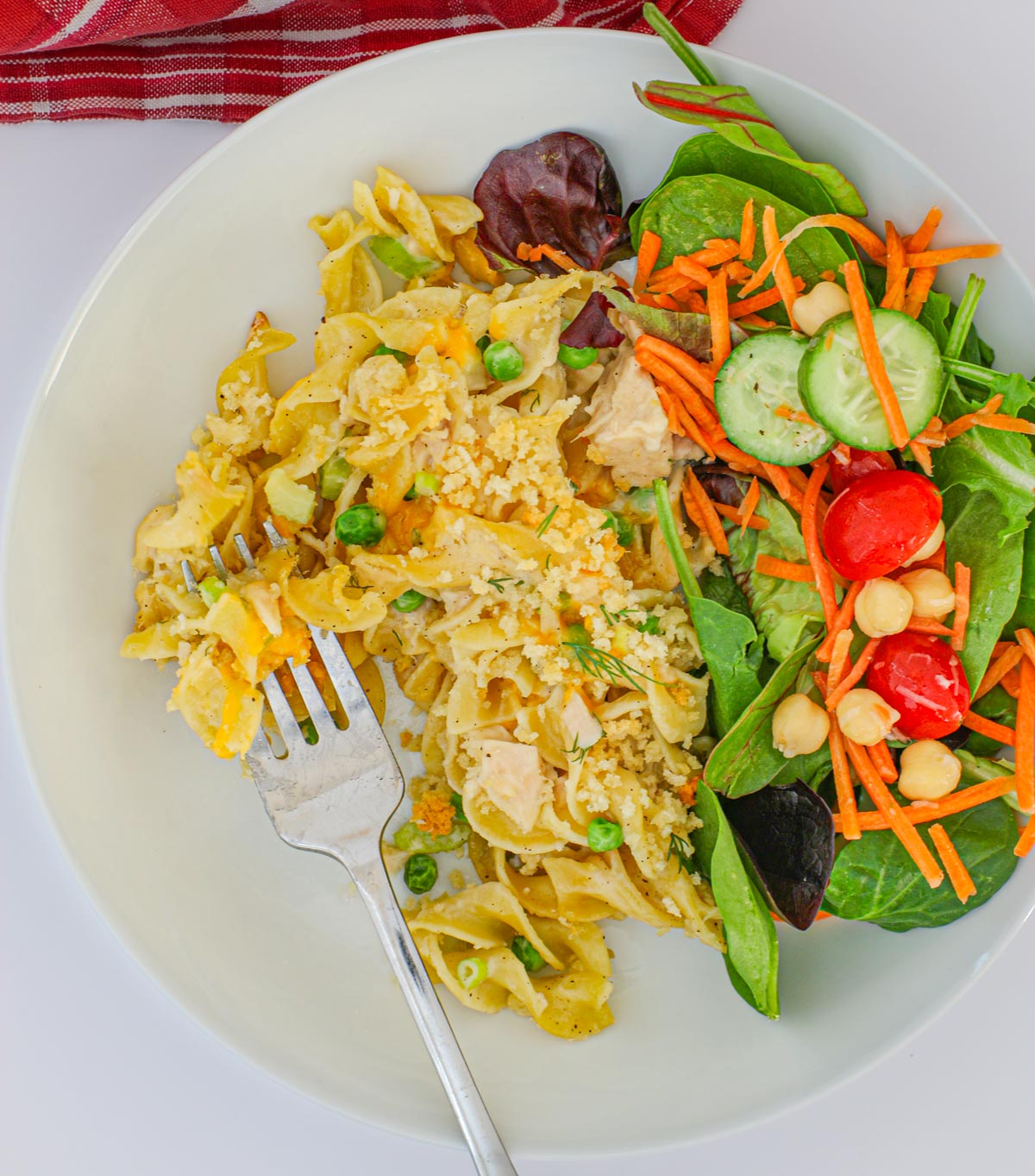 tuna casserole served with a green salad.