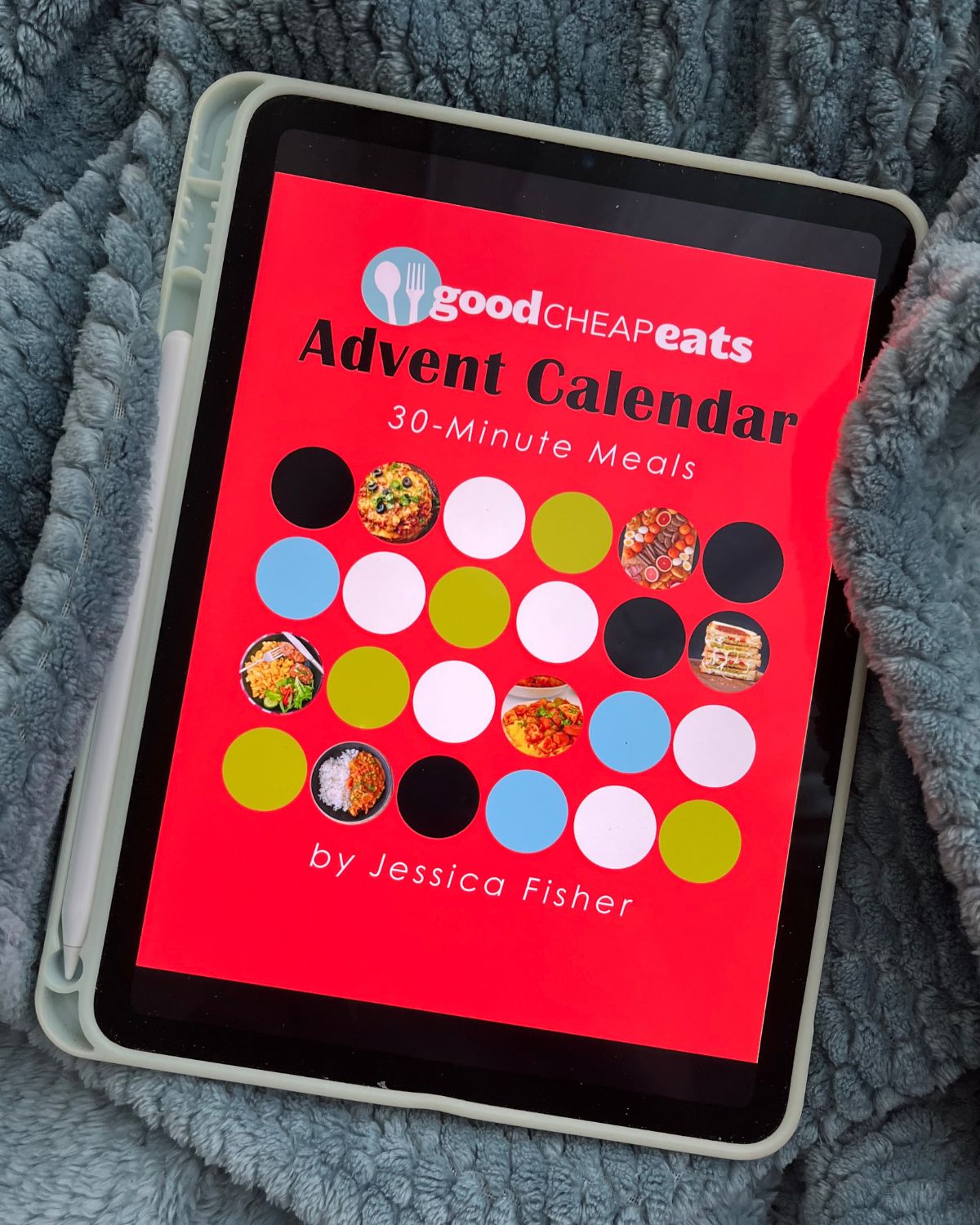 meal plan advent calendar on iPad on blue blanket.