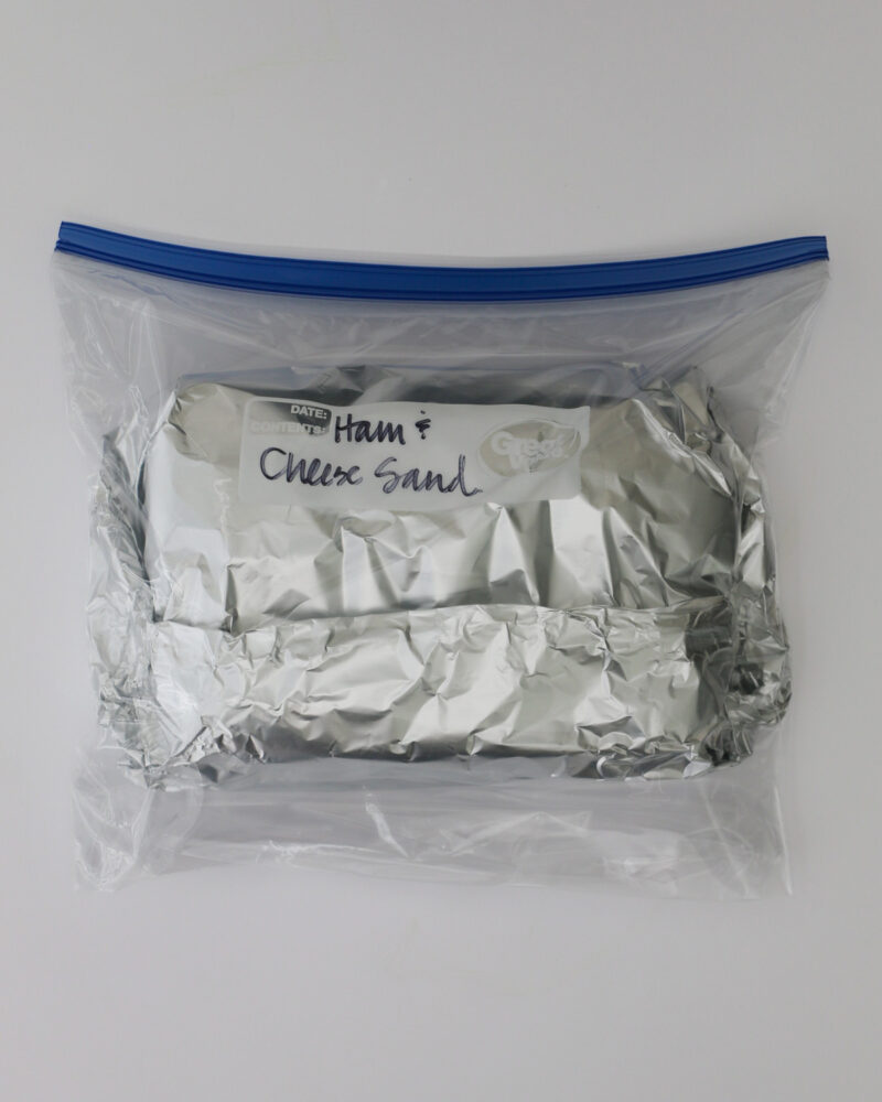 sandwiches wrapped in foil and placed in tiptop bag.