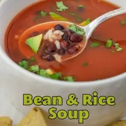 spoonful of bean and rice soup with a bit of avocado, with text overlay.