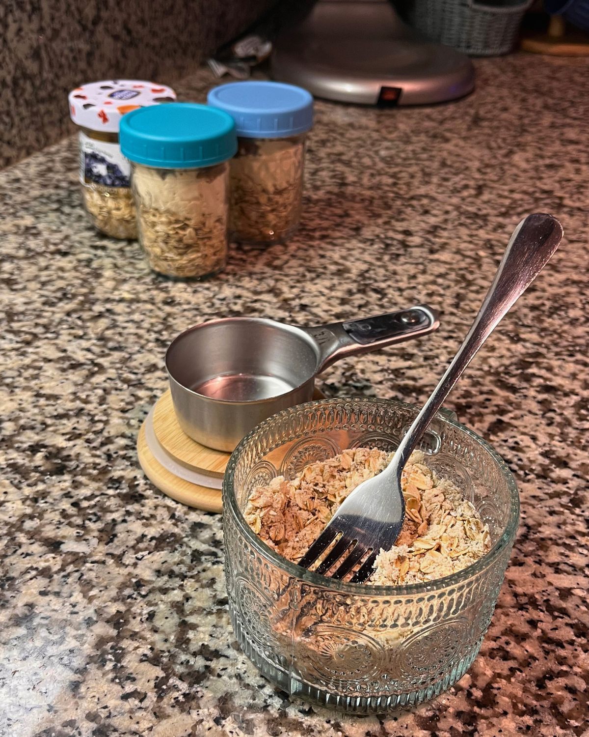 four jars of instant oats on counter.