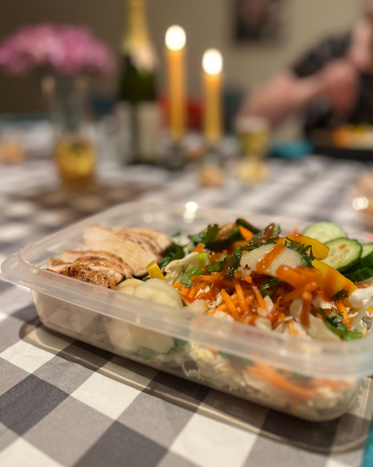 view of sunday dinner meal with lit candles.