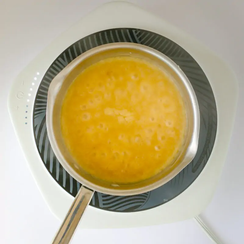 the simmering gravy in saucepan.