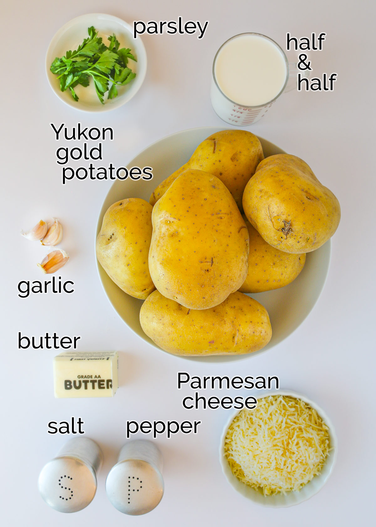 ingredients for alfredo mashed potatoes laid out on a counter.