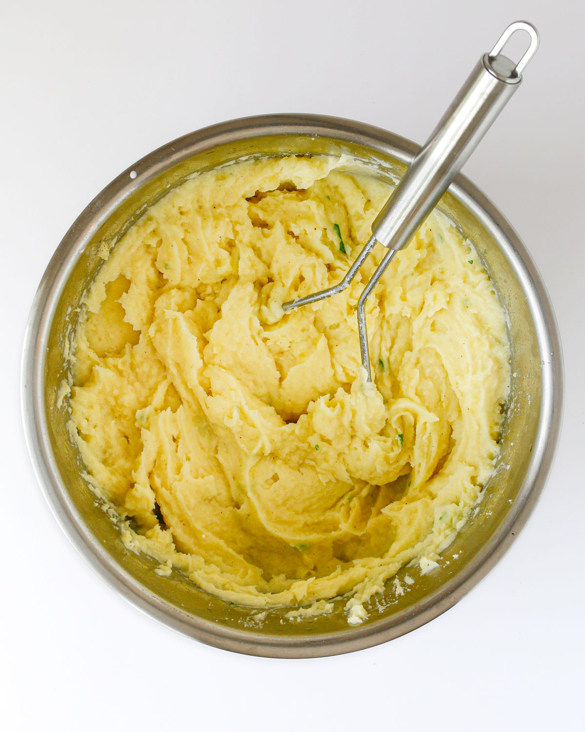 the finished whipped potatoes in the pot.