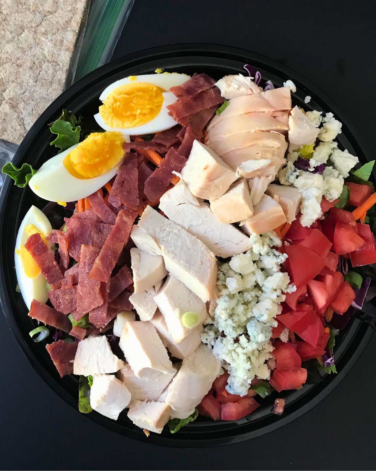 cobb salad made with chicken and bacon.