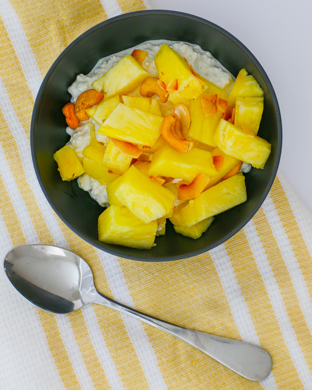 pineapple salad atop a bowl of cottage cheese.