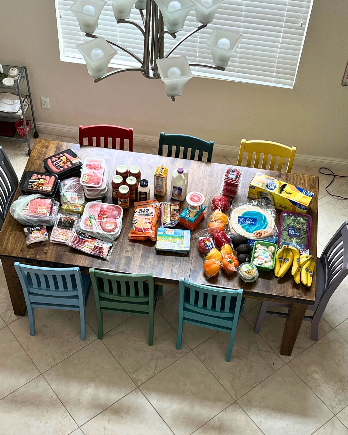 grocery items from ralphs laid out on dining room table.