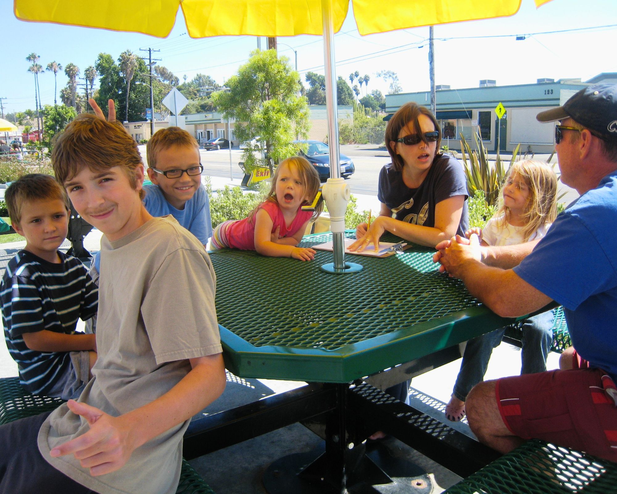 parents and kids at outdoor table at Sonic.