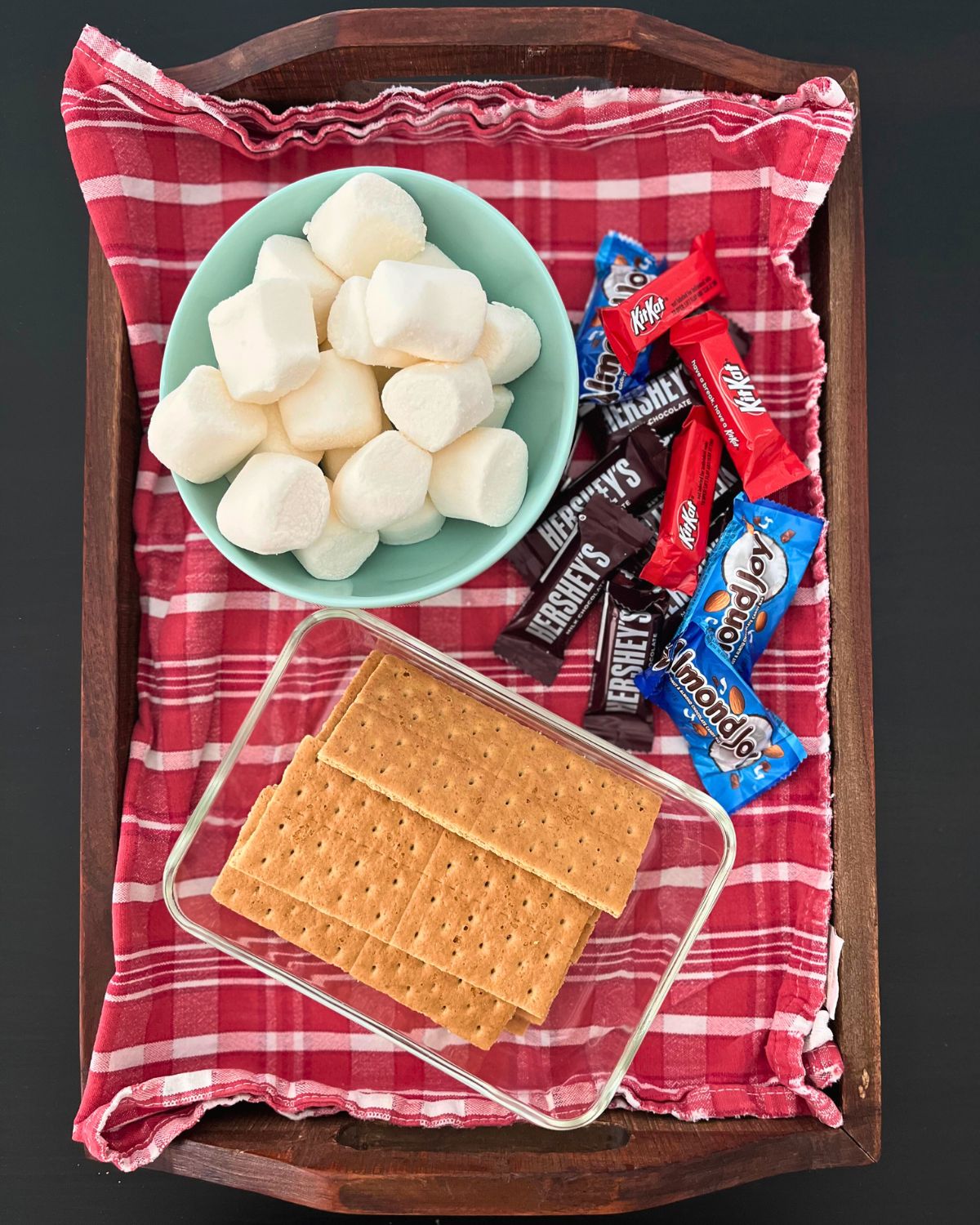 What to Do with Leftover Halloween Sweet 1 s'mores tray with crackers, marshmallows, and leftover halloween candy.