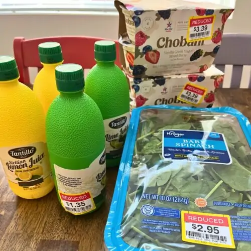 clearance groceries stacked on table.