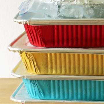 stacks of freezer meals in multi-colored pans.