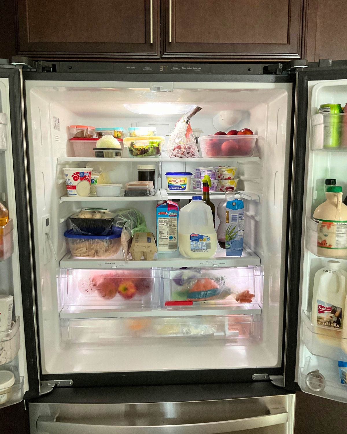 tidy fridge with open french doors.