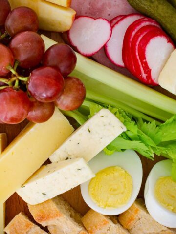 array of appetizer options on wooden board.