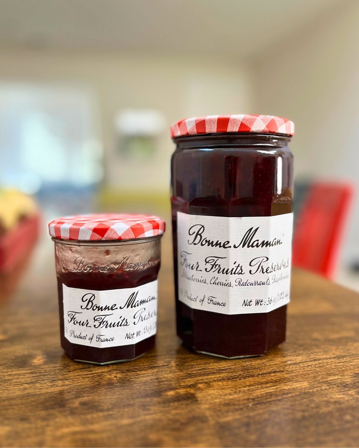 regular jam next to costco-size jam on table.
